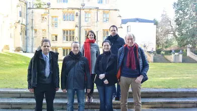6 people who ran a workshop on the Alans in front of an Oxford College